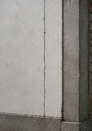 Straight vertical crack running down a wall